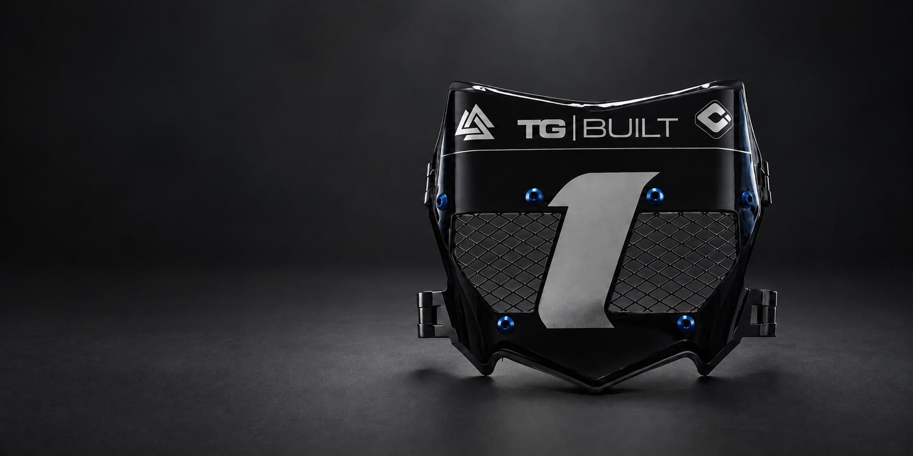 Black vented front plate with mesh openings and graphic detailing